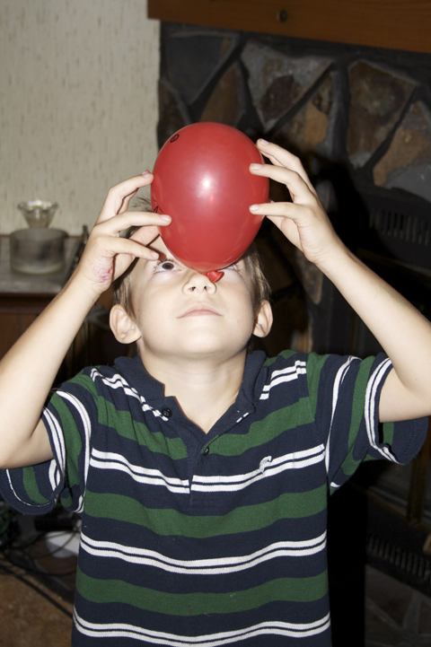 skyler balencing a balloon